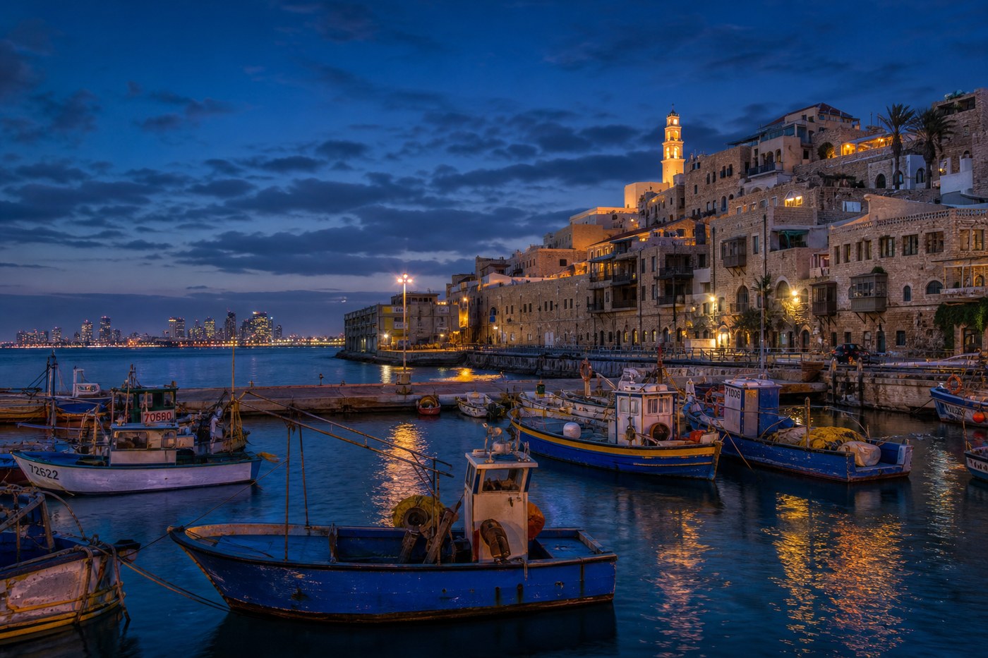 Jaffa harbor at dusk with fishing boats
